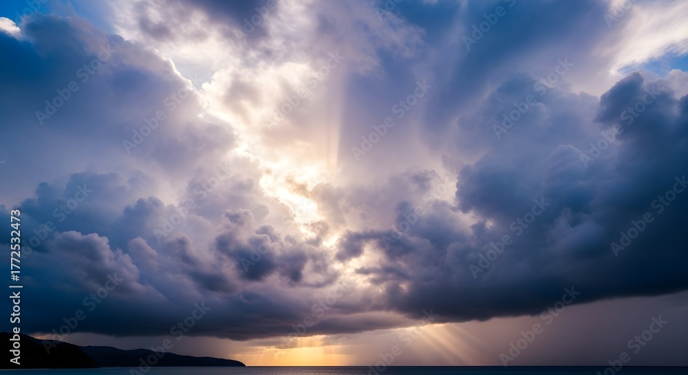 Fototapeta premium Dramatic Sun Rays Through Storm Clouds Over Ocean