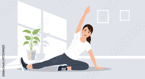 Young woman gracefully stretching in bright, modern room, embracing wellness and healthy lifestyle at home