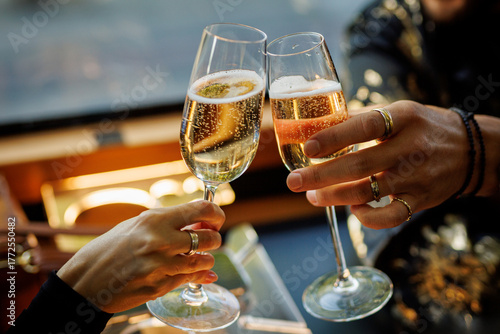 People toasting with champagne glasses at celebration