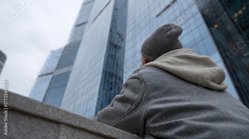 Reflective urban wanderer in cozy layers, urban exploration, skyrise reverie, World Architecture Day, urbanite serenity, skyline muse