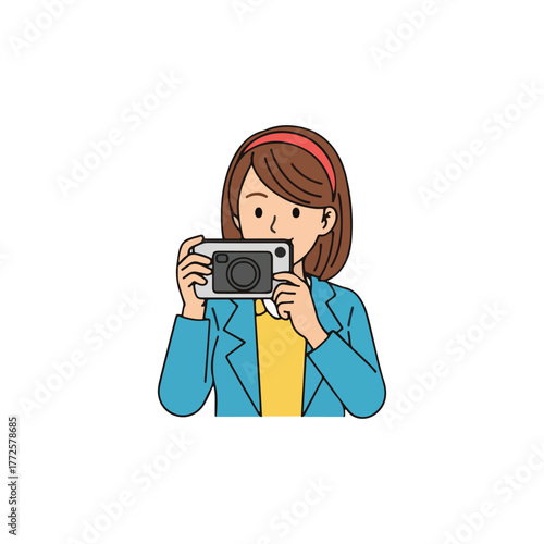 A woman with brown hair and a headband is holding a camera, taking a picture.