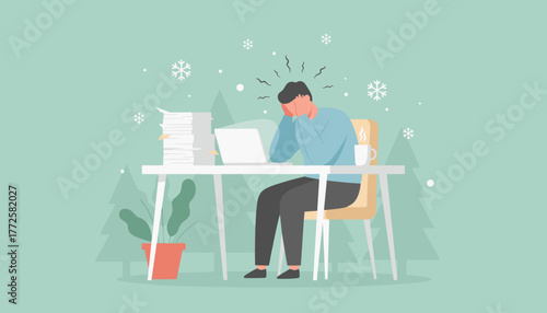 Overworked employee stressed during winter facing huge pile of paper and laptop deadlines