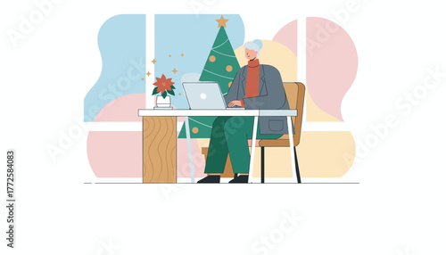 Mature professional works on a laptop in a festive office setting with a Christmas tree