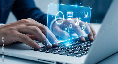 Businessman typing on a laptop with task management and workflow automation icons, planning, scheduling, and productivity improvement.