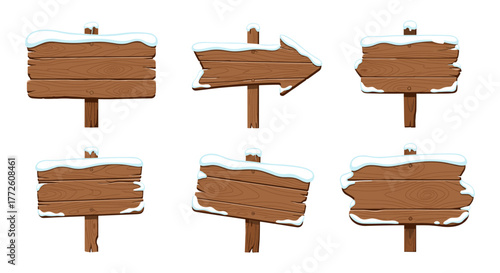 Snow-capped wooden signs collection with blank rustic directional arrows