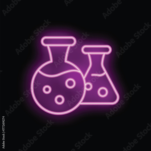 Vibrant neon sign depicting two erlenmeyer flasks with bubbling liquids, symbolizing a chemical reaction in progress