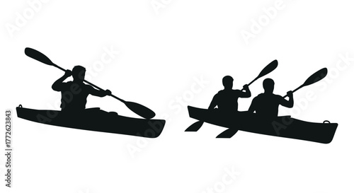 Silhouettes of two kayaks with paddlers on calm water surface