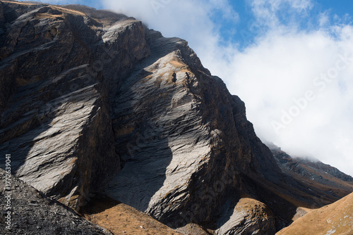 Colorful Autumn Forest and Rocky Mountains in the Alps