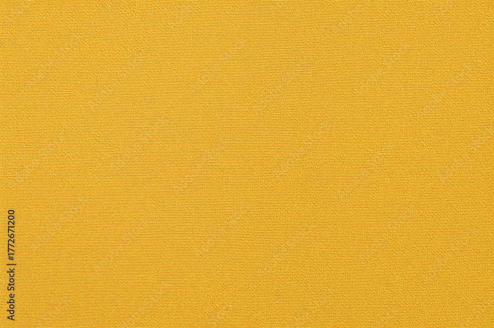 Fototapeta premium Choosing materials for interior decoration with a yellow fabric sample on a white backdrop