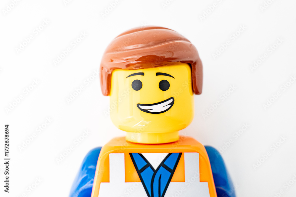 Fototapeta premium Bradford, UK Oct 30 2025 - Lego Emmet plastic toy shot close up on a white background.