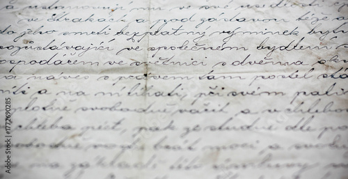 Close up of old handwritten Czech document showing part of a vintage land purchase contract about establishing a right of habitation, aged paper with calligraphic ink writing, no personal data