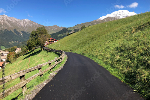 Beautiful Mountain Road of Zambla Alta Mountain Village with View on Mount Arera and Serina Valley, Italian Alps, During a Sunny Summer Day. Bergamo Province, Italy