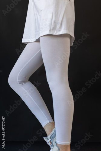 Model wearing white leggings highlighting shape, Mockup presenting waist and overall contour clearly