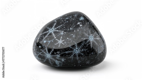 Close-up of polished snowflake obsidian stones against a white backdrop