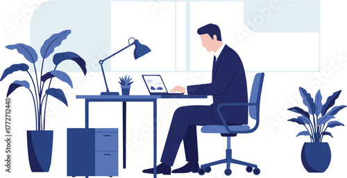 A businessman in a blue suit concentrating on his work, typing on a laptop at a modern office desk with plants