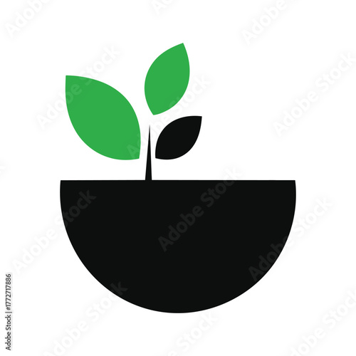 A simple black pot with a green sprout growing out of it