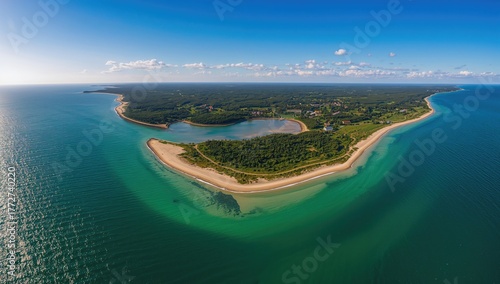 Fototapeta Naklejka Na Ścianę i Meble -  Aerial view of a coastal peninsula with the Baltic Sea and nearby bay, showcasing seasonal change