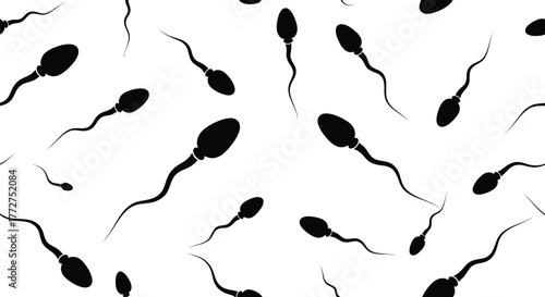 Microscopic view of sperm cells swimming with tails, symbolizing conception and life's beginning.