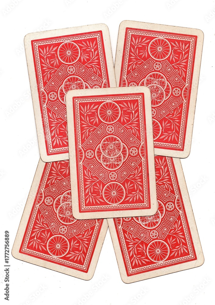 Fototapeta premium A hand of vintage playing card backs isolated on a white background.
