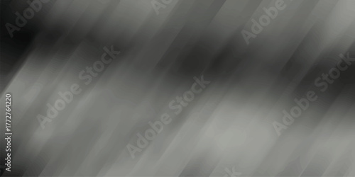 Dark grey and black abstract blurred diagonal streaks creating a sense of motion and depth for dramatic backgrounds and visual effects