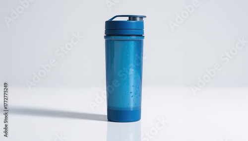 Blue sports tumbler on a wh...