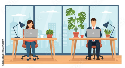 Two people working on laptops in a bright modern office space