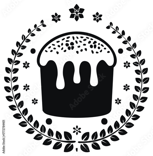 Black and white silhouette of a traditional Easter cake with icing inside a decorative folk art floral wreath