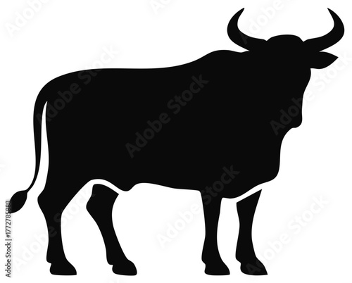 Graphic black silhouette of a powerful bull or ox standing with prominent curved horns