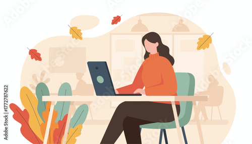 Professional woman working on laptop in a cozy autumn office environment