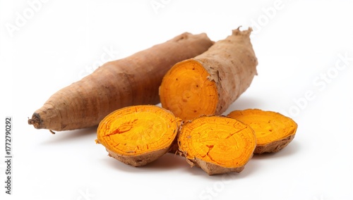 Fresh turmeric slices on a ...