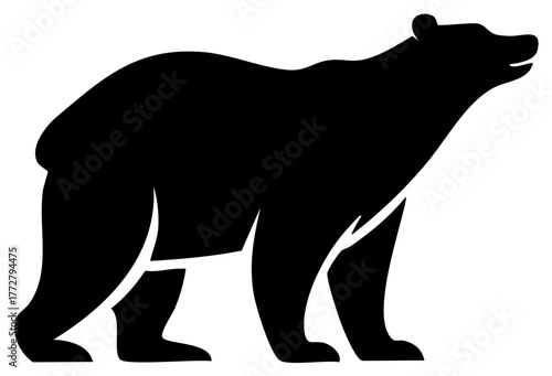 Black silhouette of a bear standing alert with head tilted upwards