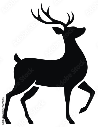 Striking black stag silhouette with prominent antlers in a graceful walking posture