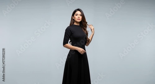 Full-Length Shot of an Elegant Indian Woman in a Sleek Black Dress Posing generative ai