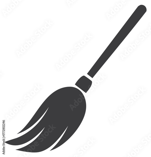 Black silhouette of a classic sweeping broom or magical witchs broomstick