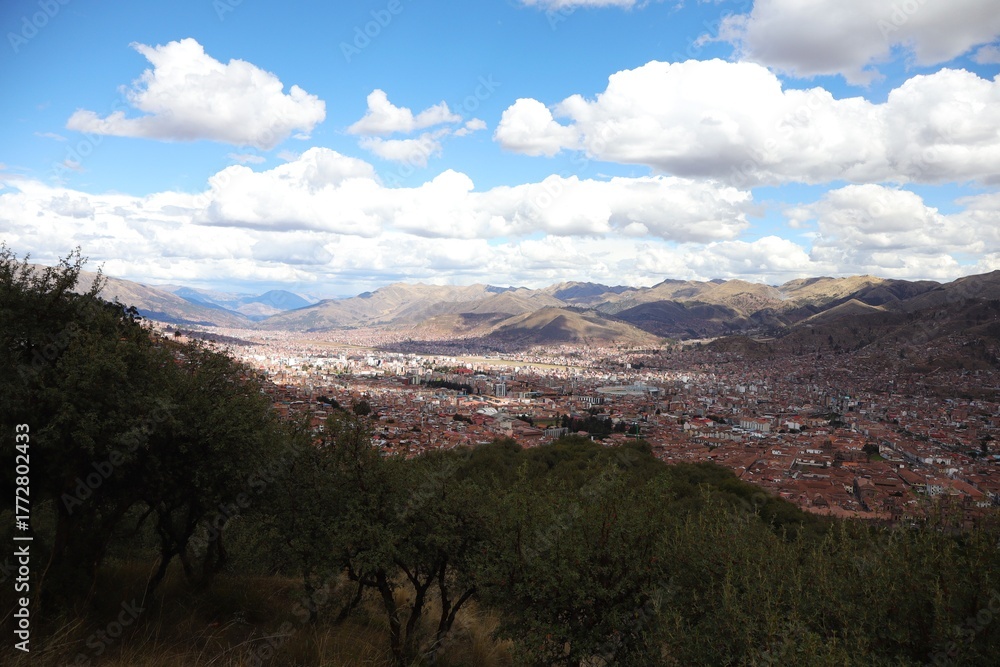 Naklejka premium Smiling Traveler Enjoying a Sunny Day in Cusco