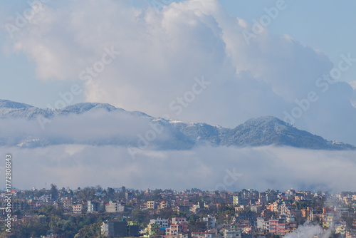 Snowfall in Kathmandu City with Hills Covered in Snow