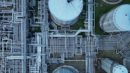 Aerial top view of oil and gas petrochemical storage tank and pipeline steel, Oil and gas transportation system pipeline steel at oil and gas refinery industry chemical plant, Pipeline oil and gas.