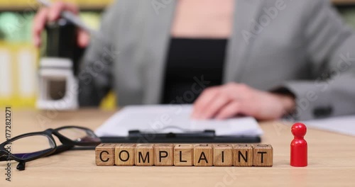 Filing a complaint in a busy office with focus on professionalism and determination