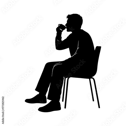 silhouette of a man sitting on a chair and drinking wine