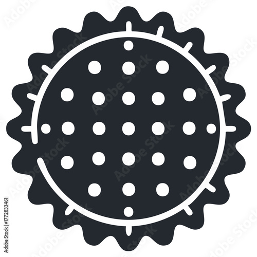 Simple glyph icon of a round cracker or savory biscuit with scalloped edges