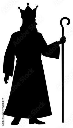 Silhouette of a king wearing a crown and holding a staff