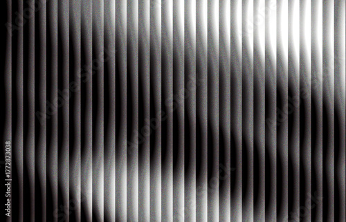 Abstract vertical lines create a modern textured background with light and shadow interplay perfect for graphic design and contemporary art projects and creative presentations