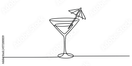 Elegant continuous line drawing of a martini glass with a cocktail umbrella a celebration drink vector