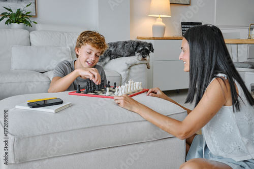 Family chess game in a cozy living room setting