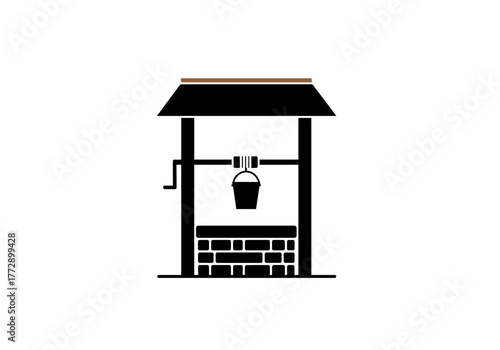 Traditional stone well with bucket and rooftop structure  