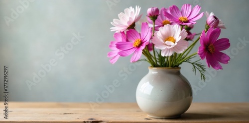 Wallpaper Mural Cosmos in a rustic vase with natural light A simple, rustic ceramic vase filled with a fresh bouquet of cosmos flowers in various pastel shades. Soft, directional natural light streams in from a Torontodigital.ca