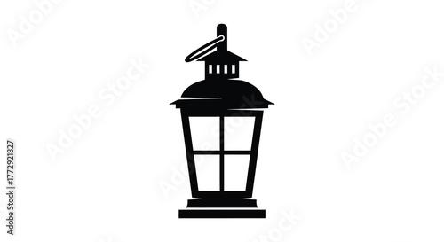 A classic vintage lantern depicted in a bold black silhouette against a clean white background evoking a sense of history and timeless design silhouette