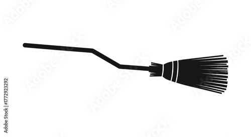 A simple black silhouette of a witch s broomstick with bristles on a white background