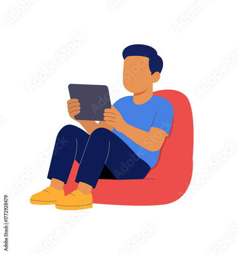 Boy Relaxing on Bean Bag Using Tablet – E-Learning & Digital Leisure