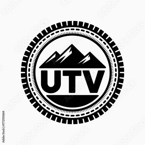 Circular utv emblem with mountains and tire tread detail